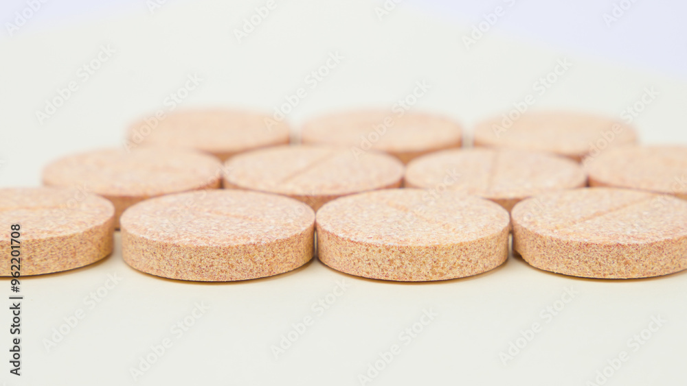 orange pills on white background orange pills on white background
