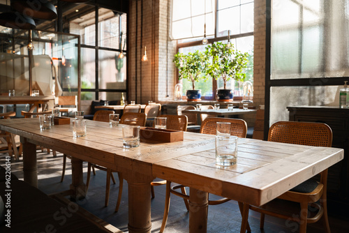 Obraz na plátně The aesthetic COZY appearance of an empty cafe with wooden furniture and minimalism