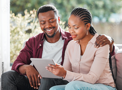 Fotografie Black people, couple and happy with tablet on sofa at home with browsing internet for house insurance options