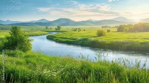 idyllic panoramic landscape with lush green meadow winding river and distant mountains soft sunlight bathes scene in warm glow creating serene spring or summer atmosphere