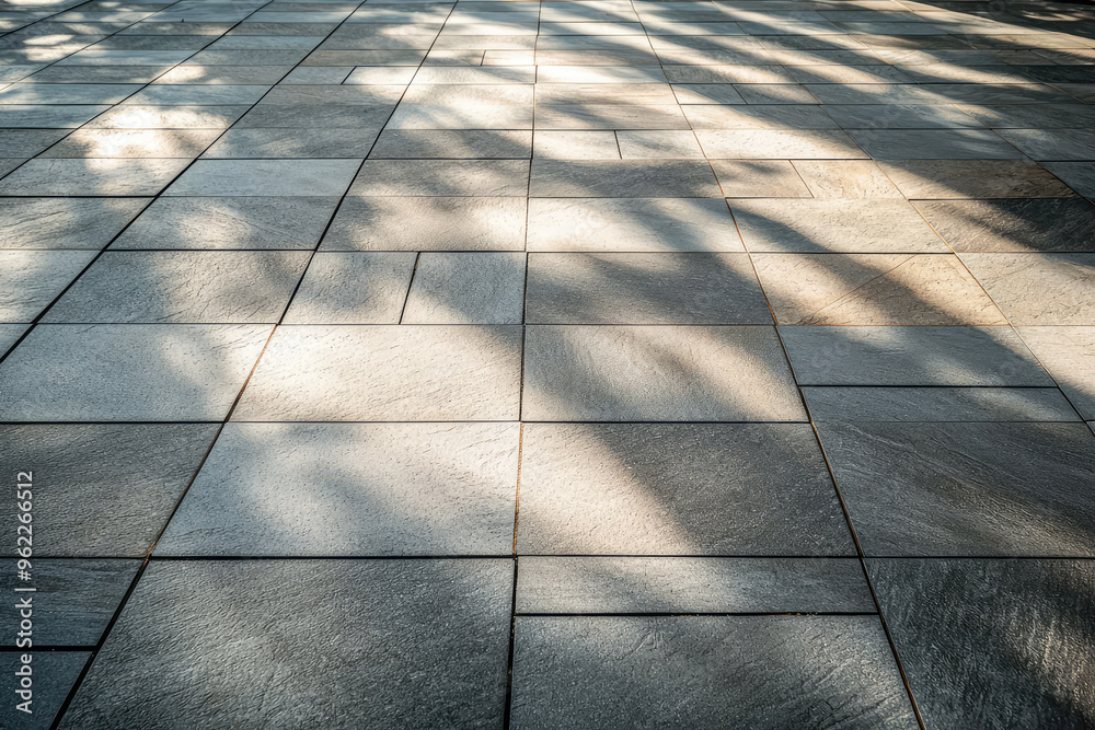 Sunlight Dappling on a Geometrically Tiled Driveway, Casting Long, Slanting Shadows.