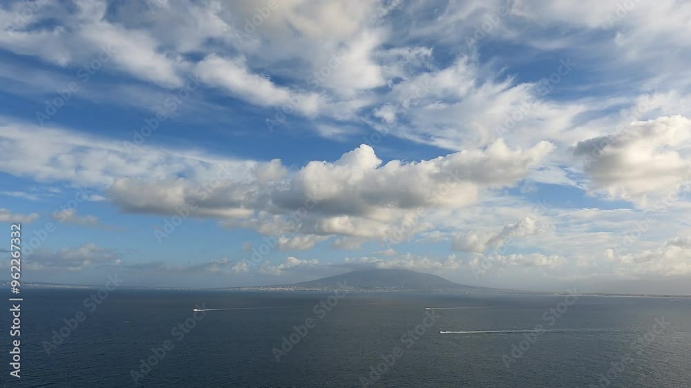 Time lapse of Vesuvio volcano across the Gulf of Naples with boat traffic