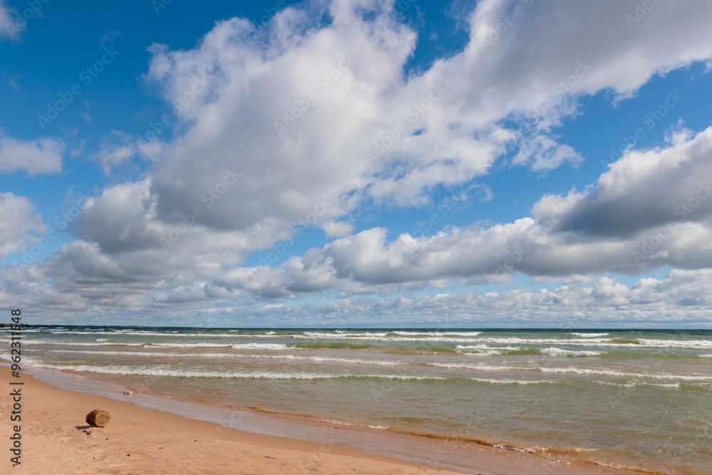 The clouds form converging lines pointing north along the shoreline of Lake Michiganat Harrington Beach State Park, Belgium, Wisconsin in early September The clouds form converging lines pointing north along the shoreline of Lake Michiganat Harrington Beach State Park, Belgium, Wisconsin in early September