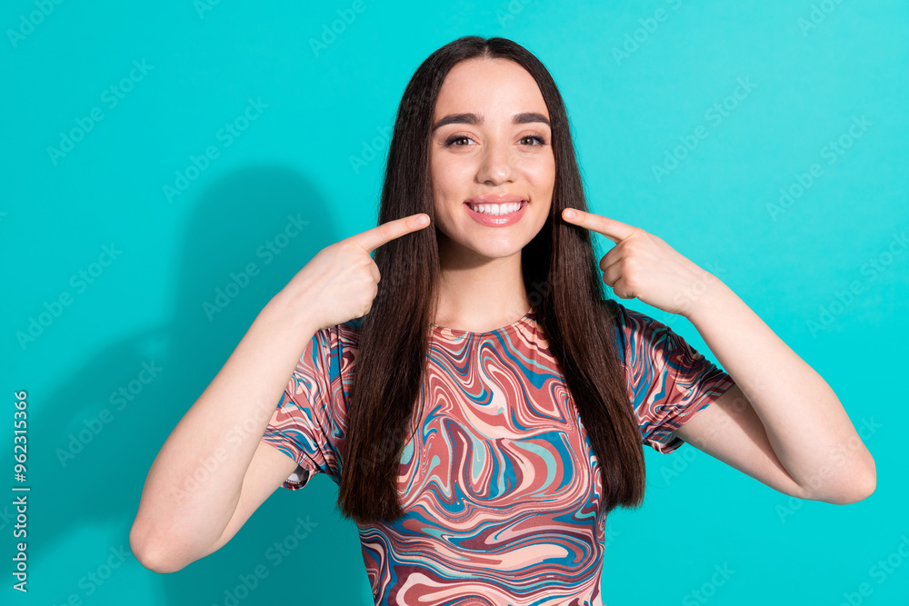 Photo of adorable lovely girl wear striped t-shirt pointing fingers white teeth isolated teal color background Photo of adorable lovely girl wear striped t-shirt pointing fingers white teeth isolated teal color background