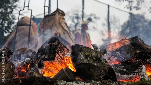 Fogo de chão, churrasco típico do sul do Brasil, costela bovina assada na brasa ao ar livre. photo