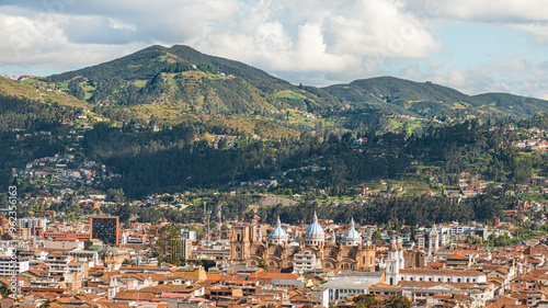 Panoramic view from above of the historic center of Cuenca in the valley with its many churches and the Boqueron mountain. View from the northern hill. Ecuador
