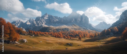 Majestic Mountain Range with Autumnal Trees and Rolling Hills