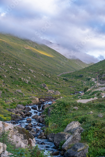 The sunlit slopes of Amaklit Plateau in Camlihemsin, with rugged rocks