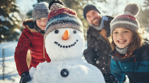 Happy children building a snowman on a snowy winter day, kids enjoying outdoor play in colorful winter clothing, joyful family holiday activity