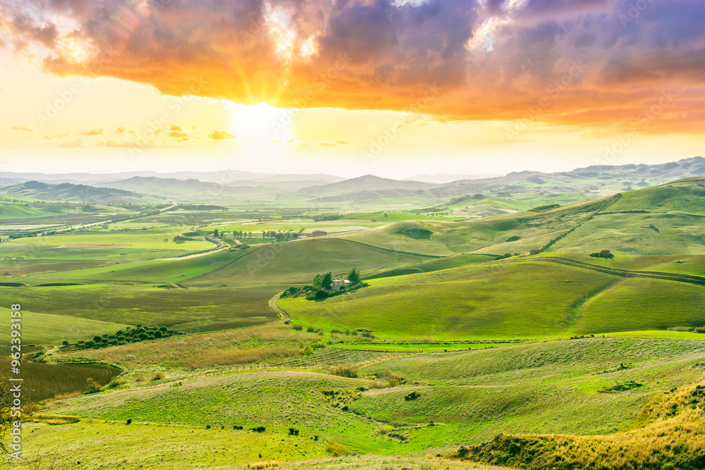 beautiful rural view at summer or spring season fields and hills with rustic grassland and nice mountains with blue cloudy sky on background of countyside landscape beautiful rural view at summer or spring season fields and hills with rustic grassland and nice mountains with blue cloudy sky on background of countyside landscape