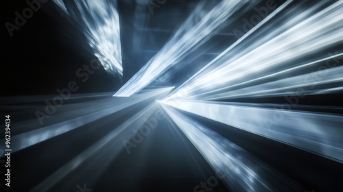 Abstract background with white light streaks on a black background.