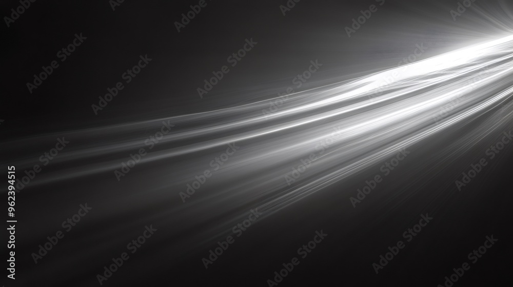 Abstract black and white background with white light streaks.