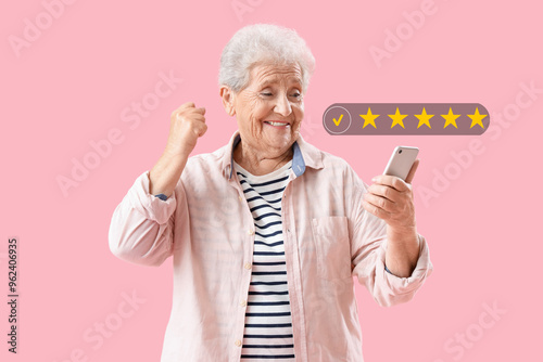 Happy senior woman using mo...