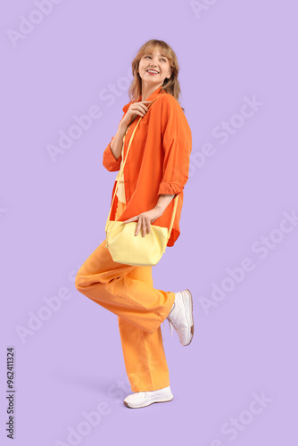 Fashionable young woman on ...