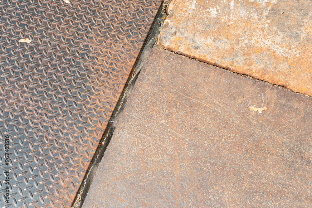 various metal plates with texture on the ground outside various metal plates with texture on the ground outside