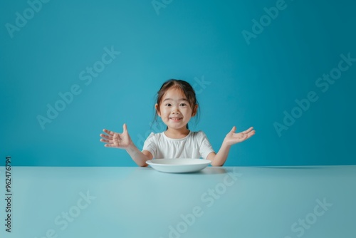 Playful girl happy smile poses front of yellow background. Girl's happy expression complements yellow playful background. Essence of simple pleasures and vibrant happiness childhood moments. photo