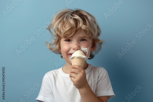 Captured candidly joyful small boy white-silvery locks is beaming. Kid enjoys the creamy goodness of ice cream. Playfulness and freedom seen jovial child summer adventure.