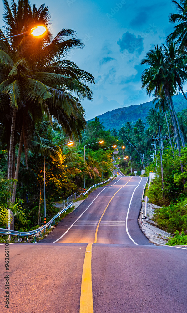 A winding rural road along the coast of Nakhon Si Thammarat Province, southern Thailand, Asia. A winding rural road along the coast of Nakhon Si Thammarat Province, southern Thailand, Asia.