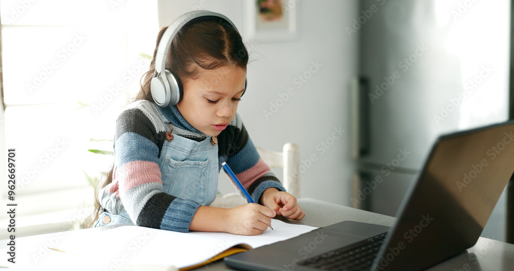 Home, girl and homework with laptop for education, elearning and connection for online class. Child, studying and cognitive development with writing for learner, knowledge and headphones in kitchen Home, girl and homework with laptop for education, elearning and connection for online class. Child, studying and cognitive development with writing for learner, knowledge and headphones in kitchen