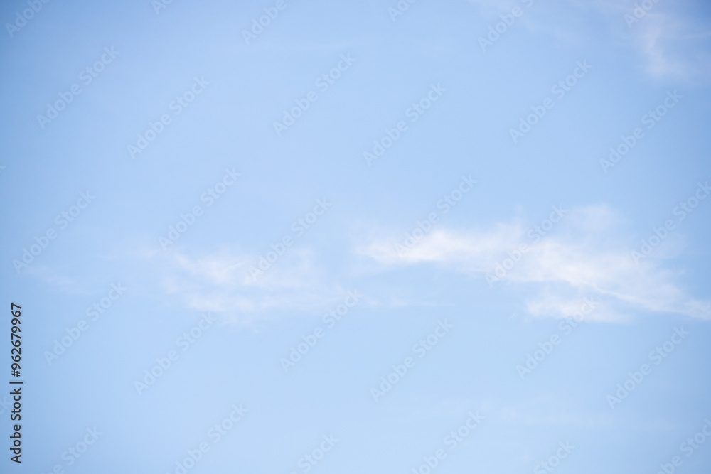 A clear blue sky with a few clouds A clear blue sky with a few clouds