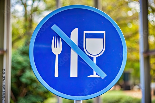 No Food Or Drink Symbol On A Blue And White Circular Sign With A Crossed-Out Fork And Glass