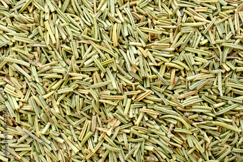 Dried rosemary, background, top view. Aromatic seasoning dried rosemary. Dry rosemary leaves, background and texture. Rosmarinus salvia. Organic dried rosemary, top view.