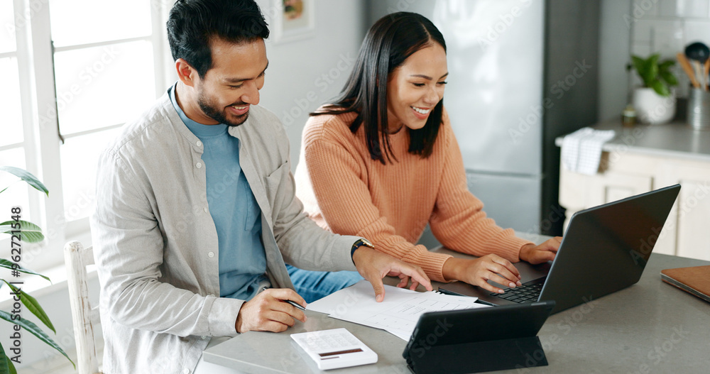 Kitchen, couple and happy with laptop for finance, track expenses and success for budget goals. Discussion, man and woman with tax review for checking, handle savings and mortgage document at home Kitchen, couple and happy with laptop for finance, track expenses and success for budget goals. Discussion, man and woman with tax review for checking, handle savings and mortgage document at home
