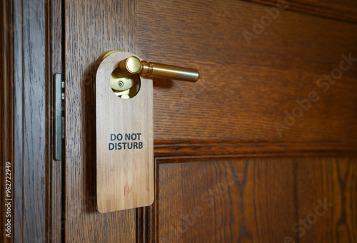 Please do not disturb sign hanging on the door handle in hotel room.