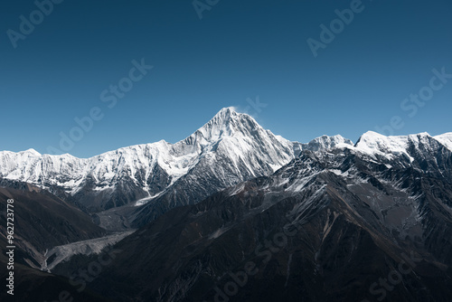 Minya Konka (Mount Gongga, Tibetan Snow Mountain) - in Sichuan Province, China. View from the west at Zimei Mountain Pass. Highest Mountain in Sichuan Province China.