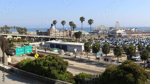 Santa Monica, California: Panorama view of Santa Monica Pier entrance with Pacific Park, oceanfront Amusement Park – Time Lapse