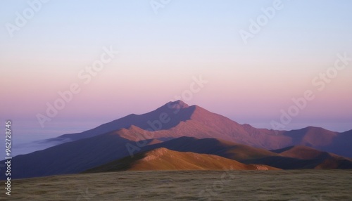 Serene Mountain National Park at Sunrise with Clear Sky and Rolling Fog Over Valleys and Peaks