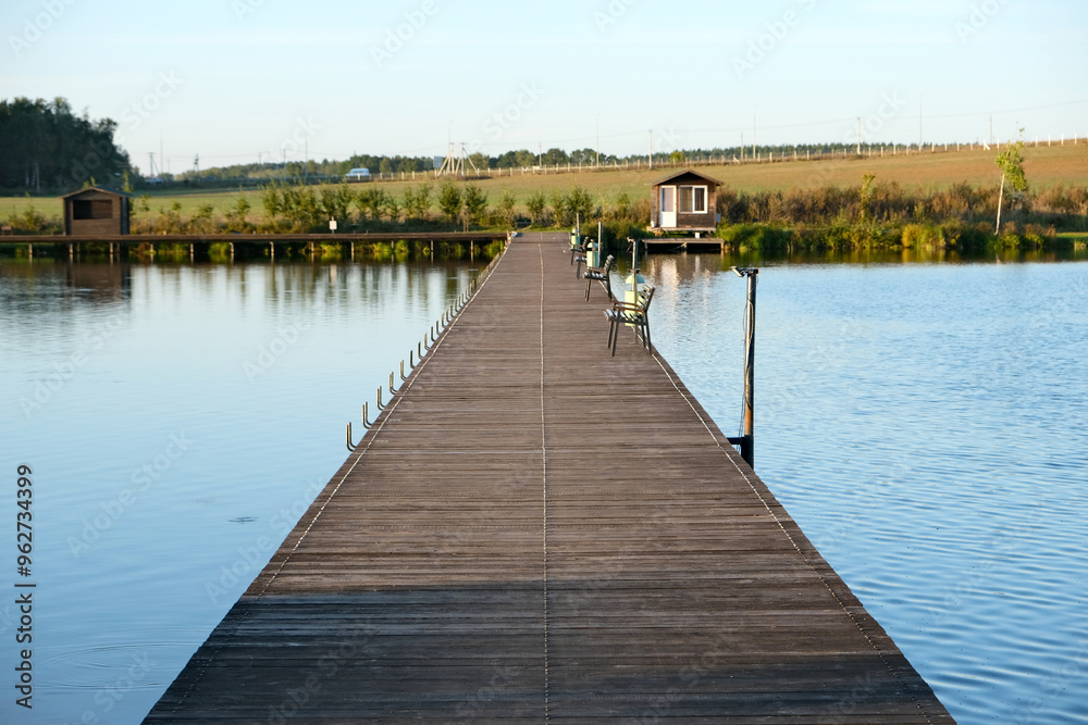 Naklejka premium a floating pier or bridge for crossing a lake and fishing from the pier