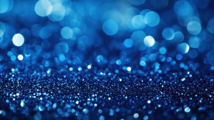 Sapphire glitter bokeh background. Unfocused shimmer royal blue sparkle. Crystal droplets wallpaper