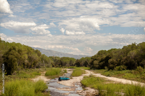 A van parked down by the river in Mexico