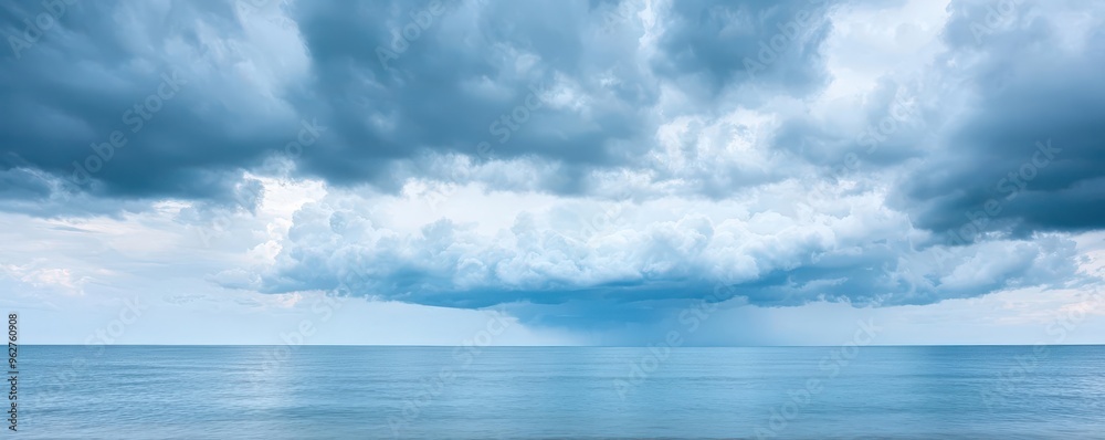 Serene ocean view under dramatic cloudy sky, perfect for evoking tranquility and the beauty of nature. Serene ocean view under dramatic cloudy sky, perfect for evoking tranquility and the beauty of nature.