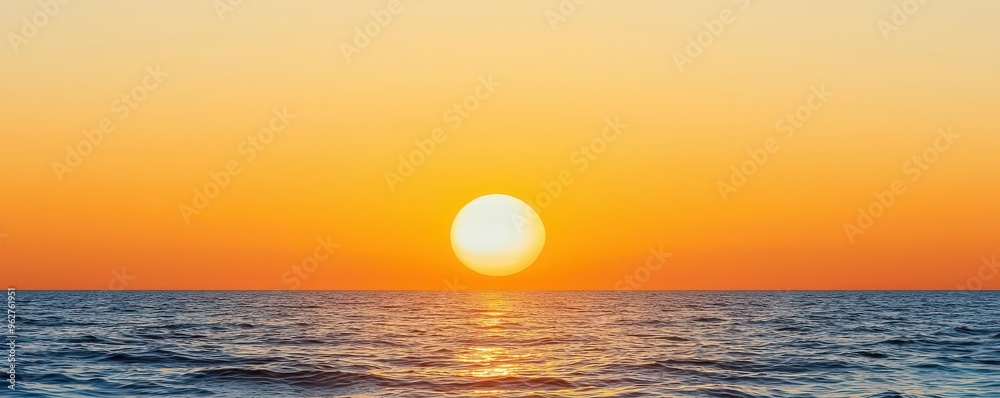 A vibrant sunset over the tranquil ocean, casting warm colors across the sky and reflecting beautifully on the water's surface. A vibrant sunset over the tranquil ocean, casting warm colors across the sky and reflecting beautifully on the water's surface.