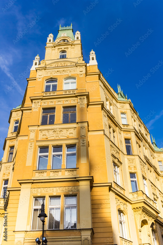 Historic yellow apartment building in Prague, Czechia
