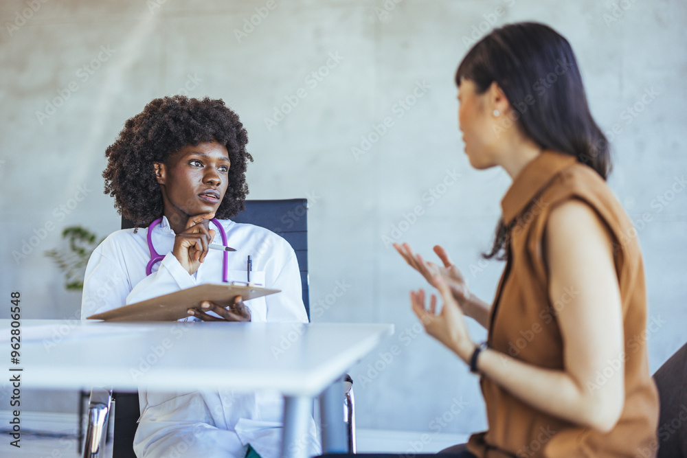 Doctor Consulting Patient in a Modern Medical Office Doctor Consulting Patient in a Modern Medical Office