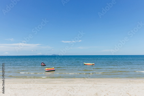 Beach sea space area. Beautiful tropical beach and Inflatable boat with blue sky and white clouds in sunny day