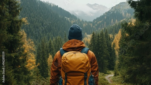 Backpacker ventures into a mountain range. photo