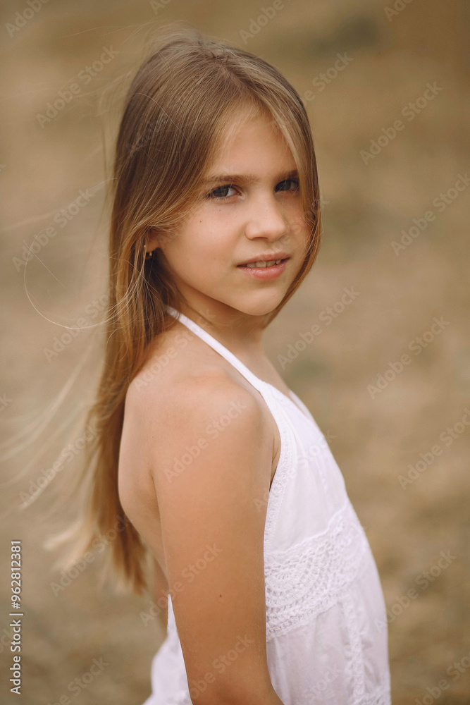 Adorable smiling blonde girl posing outdoor at summer Adorable smiling blonde girl posing outdoor at summer