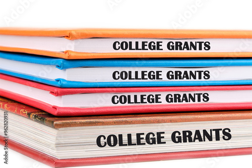 Business and COLLEGE GRANTS concept. Copy space. Grant symbol COLLEGE GRANTS phrase is repeated on the ends of the notebook