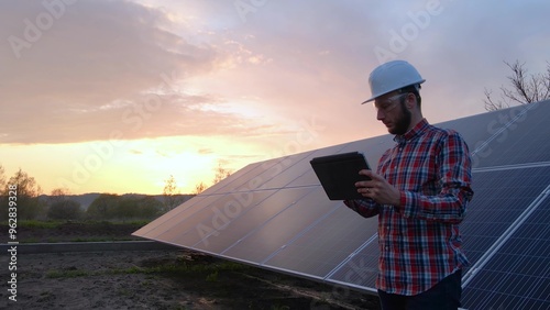 Canvas Print Technical engineer analysing solar farm solar panels data, digital future