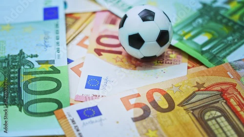 Soccer ball on stack of euro