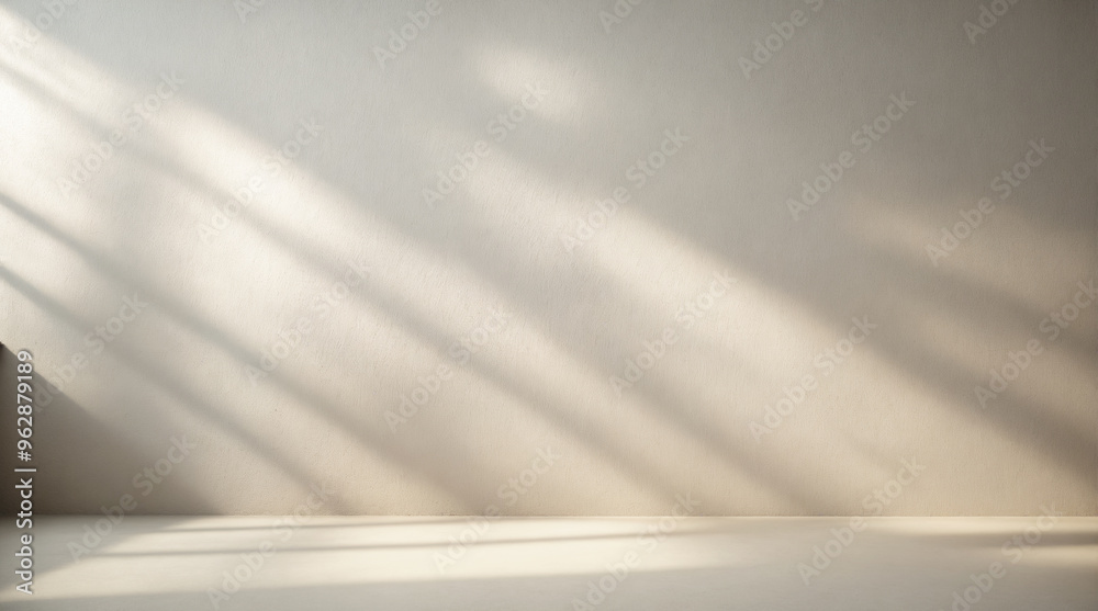 Minimalistic light background with blurred foliage shadow on wall