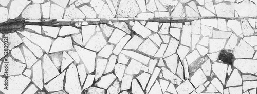 Grunge Broken Tiled Floor or Wall. Different Size tiles. Aged Surface. Rustic Texture. Black and white photo