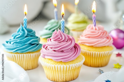 Cupcakes With Candles. Assortment of Colourful Birthday Cakes on White Table