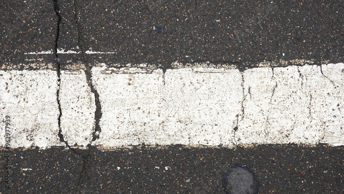 Cracked White Line On Asphalt Road Top View Gray