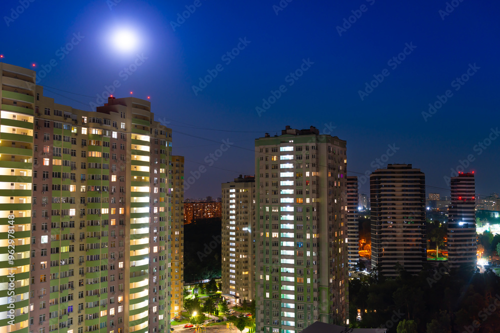 Fototapeta premium City at night, city night street with buildings and night moon light. Kyiv city, Ukraine
