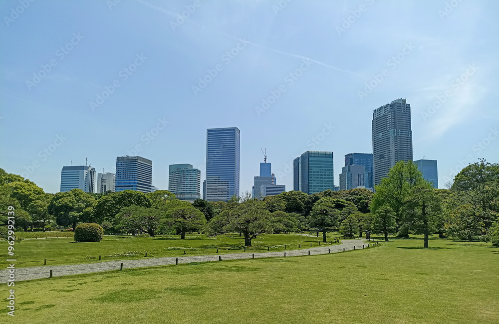 Hamarikyu Gardens surrounded by skyscrapers of Shiodome Section in Tokyo, Japan Hamarikyu Gardens surrounded by skyscrapers of Shiodome Section in Tokyo, Japan